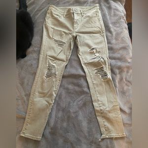 american eagle super stretch green ripped jeans/jeggings size 14